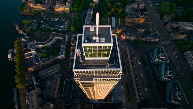 Aerial photo of the Zalmhaven Tower in Rotterdam at sunrise, a construction project supplied by Van Leeuwen.